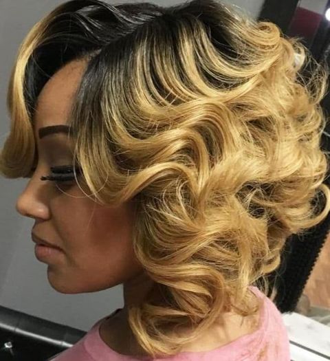 Long curly bob with blonde highligts