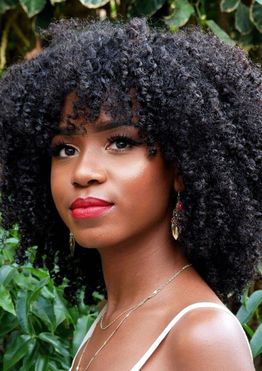 How should black women style their curly hair?